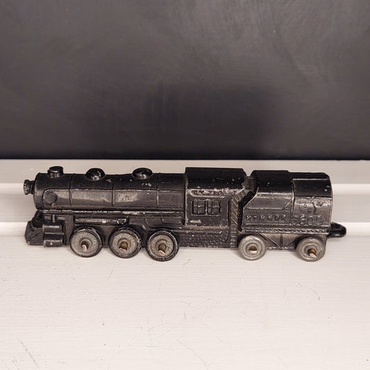 This is a vintage mid-century Toy Train Engine KT & N RR 3600 cast metal with moving wheels.
This train is embossed with the letters KT & N RR 3600 on both sides of this cast metal body.
This train engine measures 4.25 inches (11cm) long 1 inch (2.5cm) wide and 1 Inch (2.5cm) high.
The train has moving wheels which are intact and working as intended.
Very good vintage condition. Minimal wear.