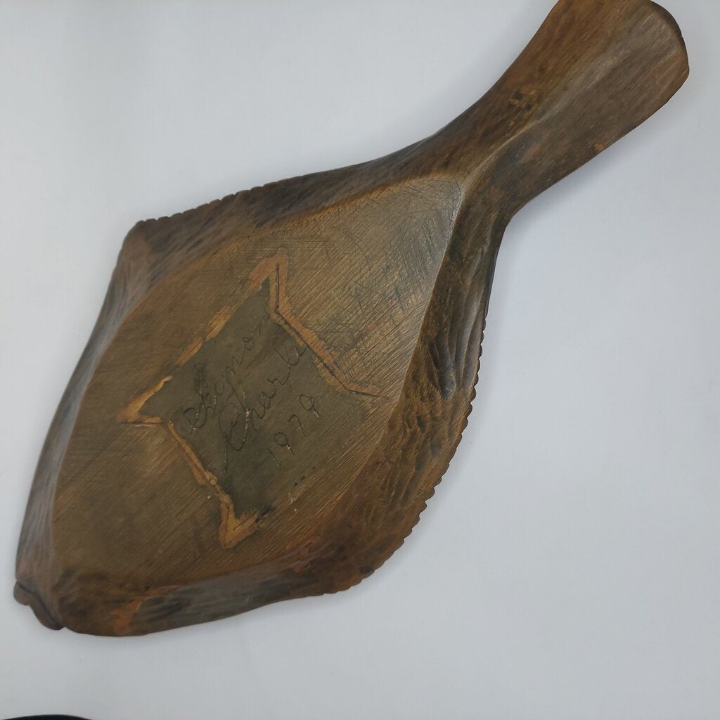 This is a Coast Salish Northwest Coast Cedar Halibut bowl carved and signed by Master Carver Simon Charlie 1979.
This Coast Salish Cedar Halibut Bowl is 16 1/4 inches (41.25cm) long and 8 inches (20.25cm) wide and is 2 1/4 inches (5.25cm) high.
Simon Charlie, known by his traditional name Hwunumetse', was a member of the Cowichan Tribes in Duncan, on Vancouver Island in BC. Simon Charlie is a Master Carver and a respected cultural leader. His work is significant to the oral traditions.