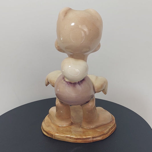 This is a David Hand's OSCAR OSTRICH Figurine 1154 of Animaland Series by Beswick England. 1949-1955
The Oscar Ostrich figurine is one of eight characters in David Hand's Animaland character series.
The figurine is 3-3/4 inches (9.5cm) tall.  
The backstamp is gold and reads: David Hand's Animaland, "Oscar Ostrich" Beswick England (circle) 35, Copyright by GB Animations Ltd.