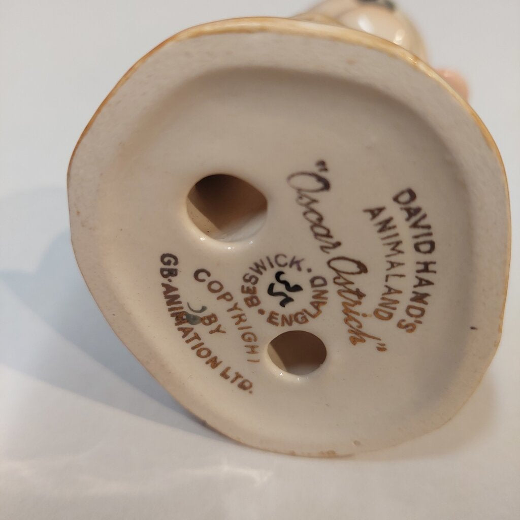 This is a David Hand's OSCAR OSTRICH Figurine 1154 of Animaland Series by Beswick England. 1949-1955
The Oscar Ostrich figurine is one of eight characters in David Hand's Animaland character series.
The figurine is 3-3/4 inches (9.5cm) tall.  
The backstamp is gold and reads: David Hand's Animaland, "Oscar Ostrich" Beswick England (circle) 35, Copyright by GB Animations Ltd.