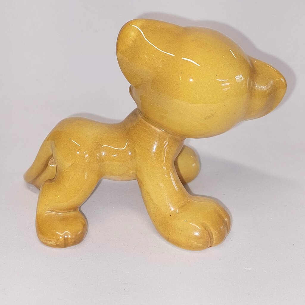 This is a David Hand's ZIMMY LION 1150 of Animaland Series by Beswick England. 1949-1955
The ZIMMY LION figurine is one of eight characters in David Hand's Animaland character series.
The figurine is 3-1/4 inches (8.25cm) tall.  
The backstamp is gold and reads: David Hand's Animaland, "Zimmy Lion 1150" Beswick England 6, Copyright by GB Animations Ltd.
