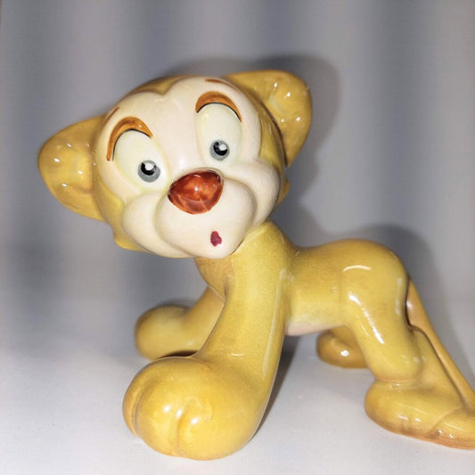 This is a David Hand's ZIMMY LION 1150 of Animaland Series by Beswick England. 1949-1955
The ZIMMY LION figurine is one of eight characters in David Hand's Animaland character series.
The figurine is 3-1/4 inches (8.25cm) tall.
The backstamp is gold and reads: David Hand's Animaland, "Zimmy Lion 1150" Beswick England 6, Copyright by GB Animations Ltd.