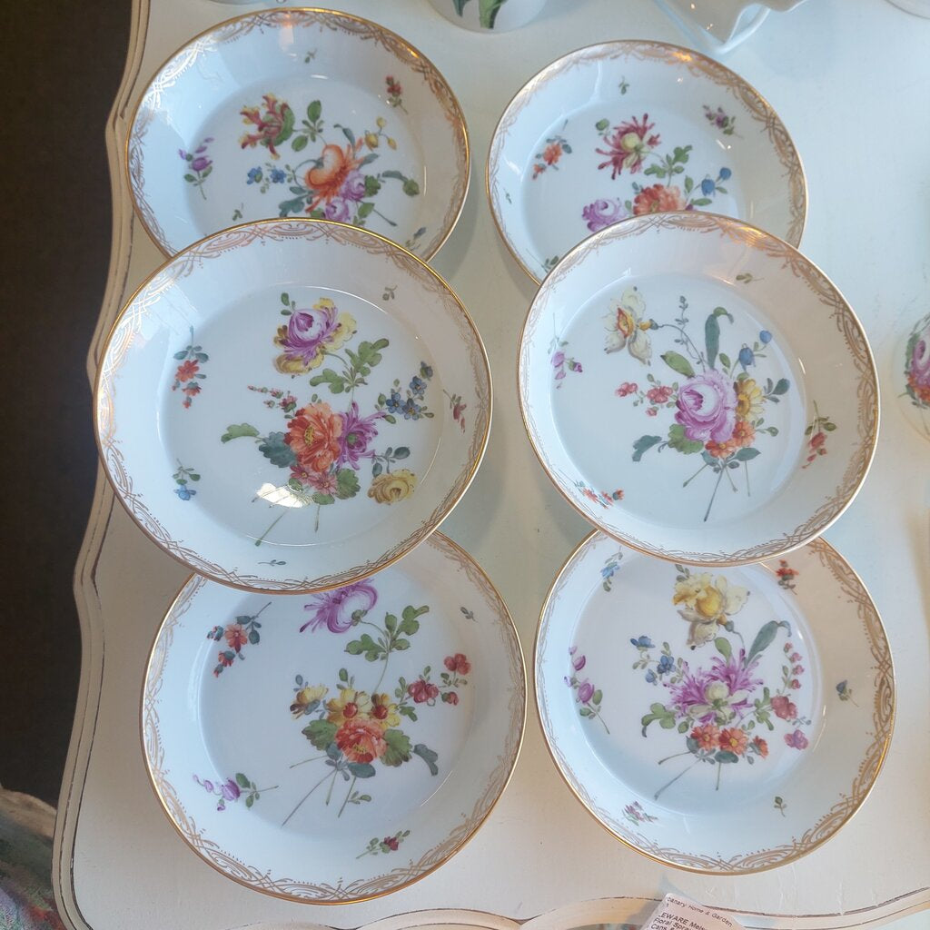 This is a 12 piece Meissen Dresden set of 6 Coupe Plates and 6 Coffee can cups in the Floral Sprays pattern.
There are 6 coffee cans and 6 coupe shaped dessert or fruit plates.
The dishes are hand painted with the Floral Sprays pattern with a large spray and individual flower sprays around it. The rim is decorated in a drape pattern in gold. Each can cup has a single flower painted in the bottom.