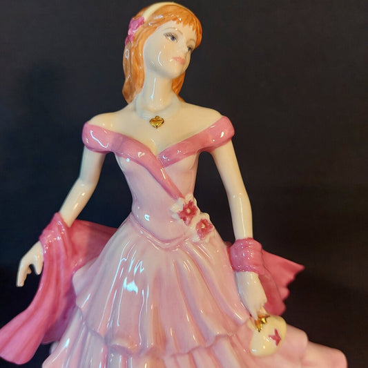 This is a Coalport Sentiments bone china figurine BIRTHDAY WISHES.
This Coalport figurine is 6 inches (15cm) wide, 5 inches (13cm) deep, and 7 inches (18cm) tall.
This figurine is a 2005 Sentiment Series of bone china ladies named Birthday Wishes.