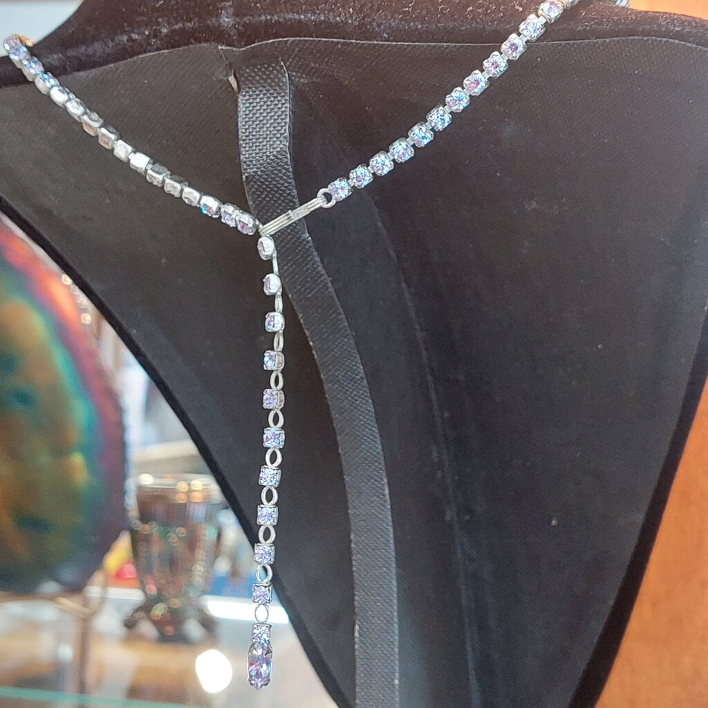 This is a rare vintage 1950s Sherman necklace, clip on earrings, and brooch set in an amazing mauve colour. The crystals are a unique mix of baguette, marquise, round, and teardrop cuts. The 4 piece set comes in their original hinged box.