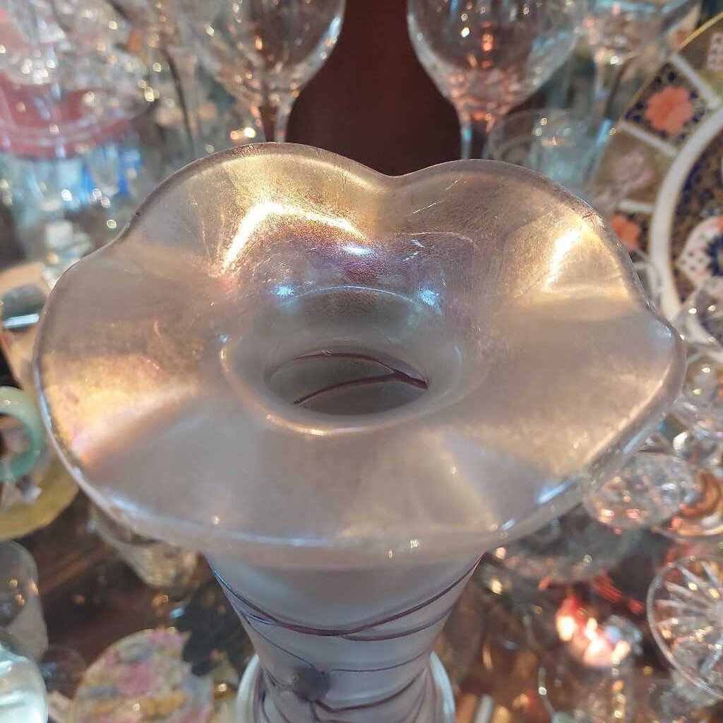 This is a 1960s - 70s Poschinger blown art glass vase. This piece is associated with Baron Von Poschinger and is hand blown with applied glass threads. 
The vase is iridescent with purple threads. 
The vase is 4.75 inches (12cm) wide at the top and is 10 inches (25.5cm) tall.
The vase is heavy at the bottom and opens to a flared rim.
A recognized Baron Von Poschinger design. 
In excellent condition. No chips, no cracks, no scratches, no repairs.