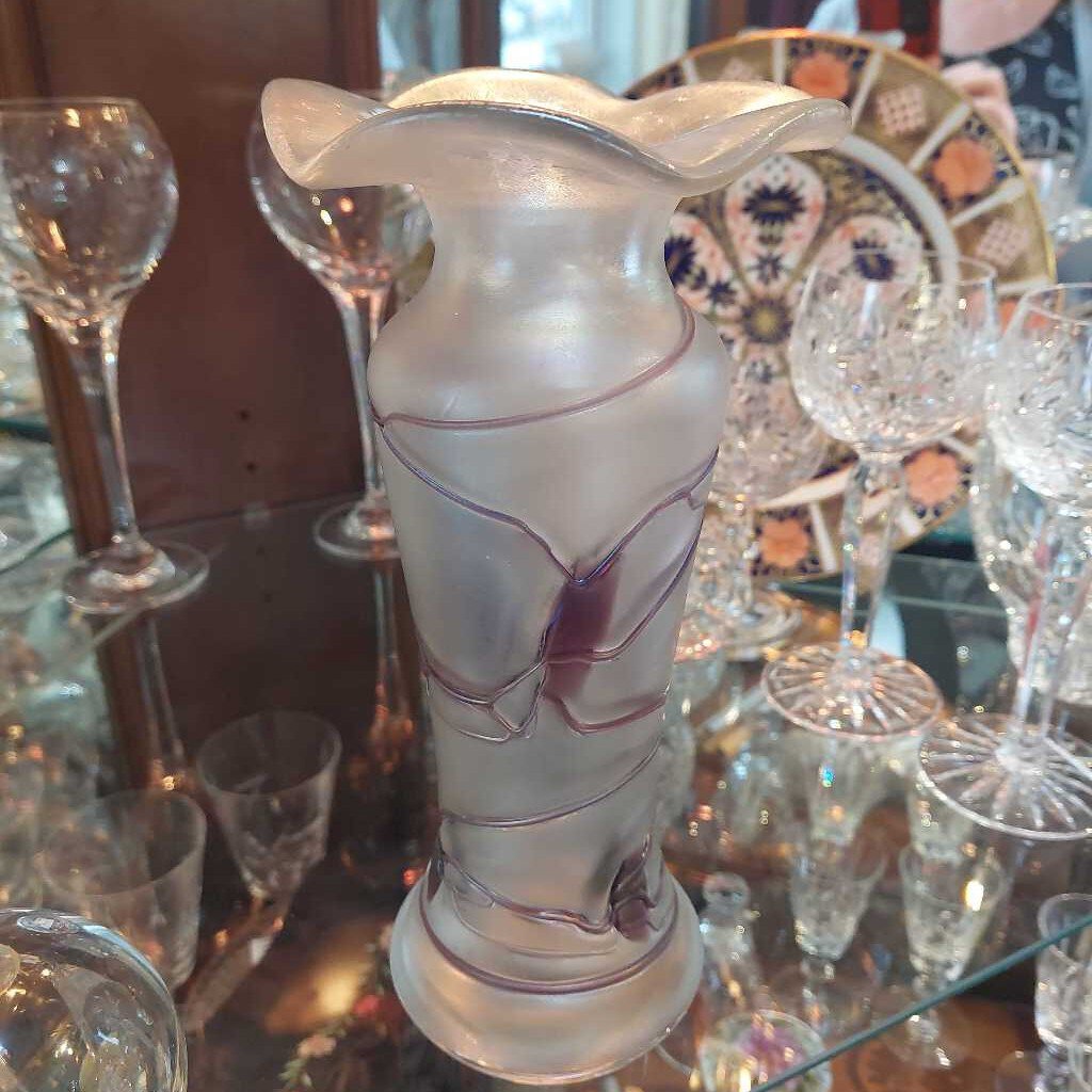 This is a 1960s - 70s Poschinger blown art glass vase. This piece is associated with Baron Von Poschinger and is hand blown with applied glass threads. 
The vase is iridescent with purple threads. 
The vase is 4.75 inches (12cm) wide at the top and is 10 inches (25.5cm) tall.
The vase is heavy at the bottom and opens to a flared rim.
A recognized Baron Von Poschinger design. 
In excellent condition. No chips, no cracks, no scratches, no repairs.