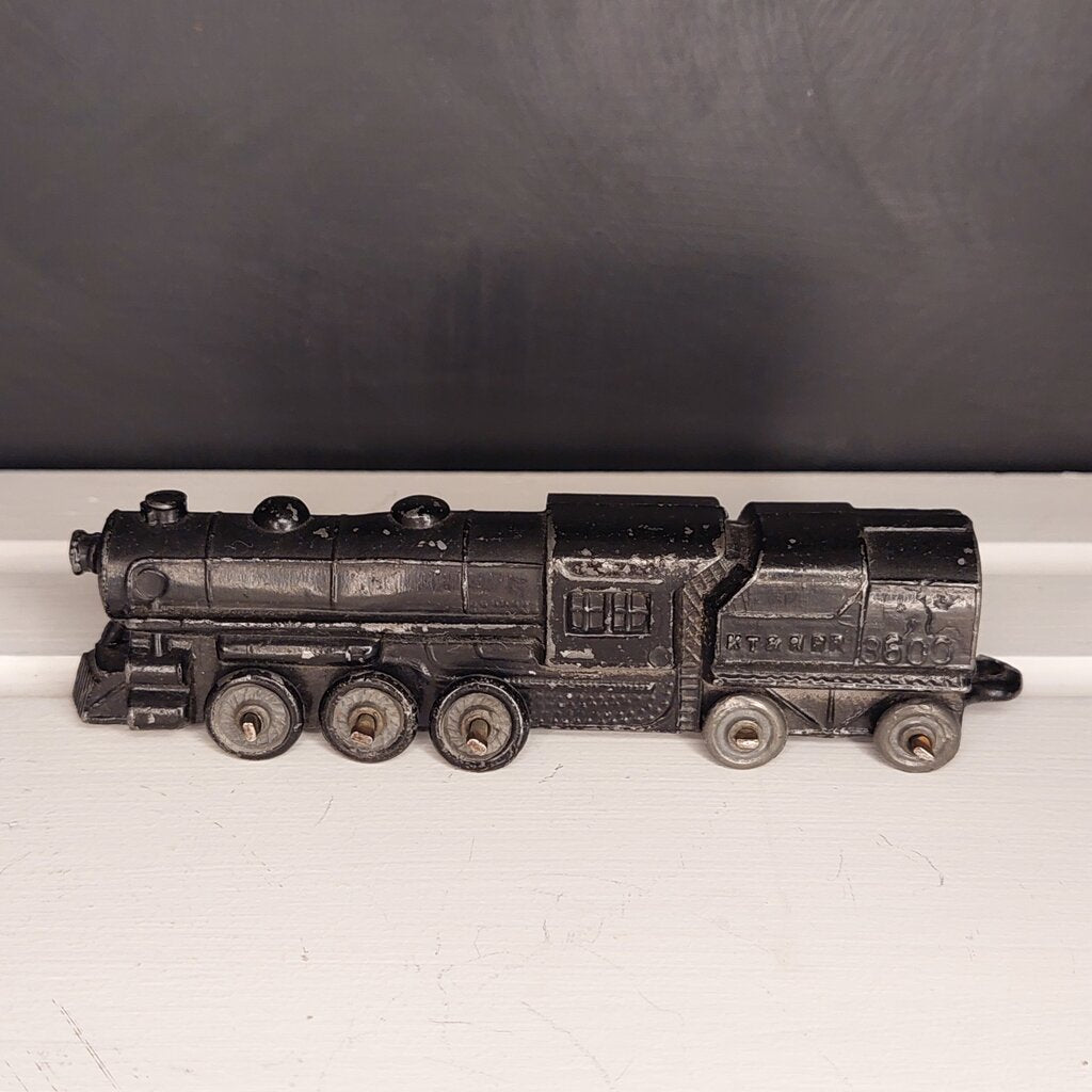 This is a vintage mid-century Toy Train Engine KT &amp; N RR 3600 cast metal with moving wheels.


This train is embossed with the letters KT &amp; N RR 3600 on both sides of this cast metal body.


This train engine measures 4.25 inches (11cm) long 1 inch (2.5cm) wide and 1 Inch (2.5cm) high.


The train has moving wheels which are intact and working as intended.


Very good vintage condition. Minimal wear.
