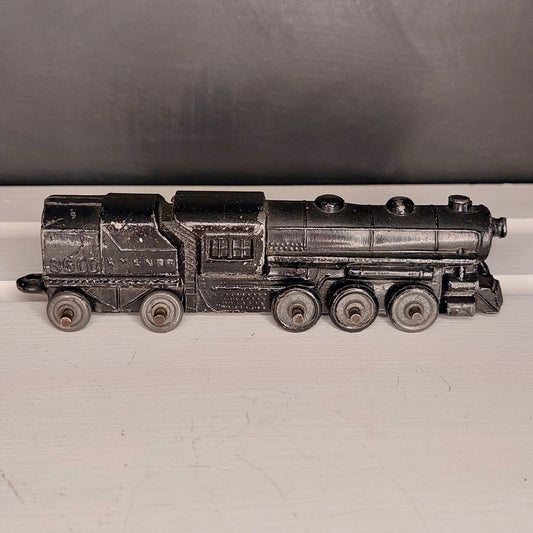 This is a vintage mid-century Toy Train Engine KT &amp; N RR 3600 cast metal with moving wheels.


This train is embossed with the letters KT &amp; N RR 3600 on both sides of this cast metal body.


This train engine measures 4.25 inches (11cm) long 1 inch (2.5cm) wide and 1 Inch (2.5cm) high.


The train has moving wheels which are intact and working as intended.


Very good vintage condition. Minimal wear.