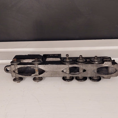 This is a vintage mid-century Toy Train Engine KT &amp; N RR 3600 cast metal with moving wheels.


This train is embossed with the letters KT &amp; N RR 3600 on both sides of this cast metal body.


This train engine measures 4.25 inches (11cm) long 1 inch (2.5cm) wide and 1 Inch (2.5cm) high.


The train has moving wheels which are intact and working as intended.


Very good vintage condition. Minimal wear.