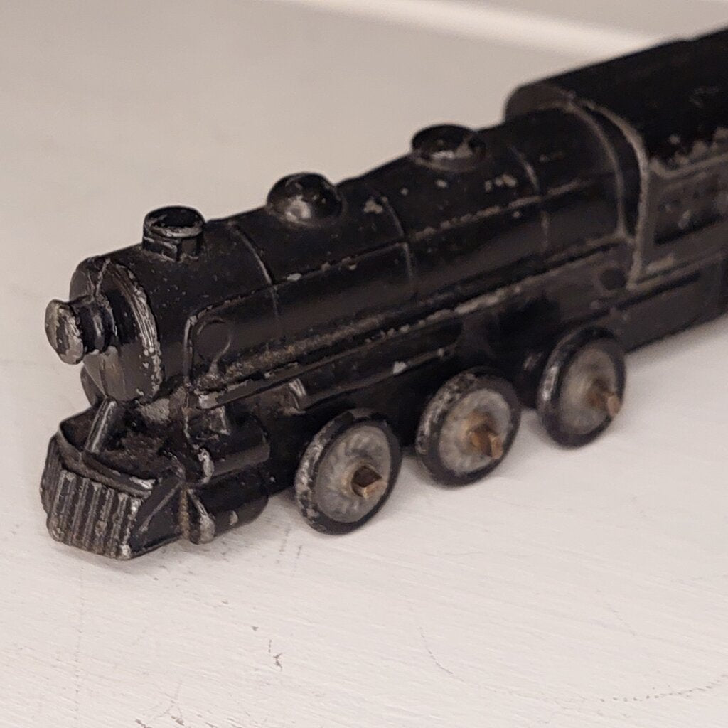 This is a vintage mid-century Toy Train Engine KT &amp; N RR 3600 cast metal with moving wheels.


This train is embossed with the letters KT &amp; N RR 3600 on both sides of this cast metal body.


This train engine measures 4.25 inches (11cm) long 1 inch (2.5cm) wide and 1 Inch (2.5cm) high.


The train has moving wheels which are intact and working as intended.


Very good vintage condition. Minimal wear.