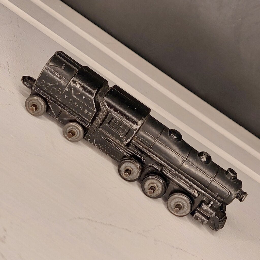 This is a vintage mid-century Toy Train Engine KT &amp; N RR 3600 cast metal with moving wheels.


This train is embossed with the letters KT &amp; N RR 3600 on both sides of this cast metal body.


This train engine measures 4.25 inches (11cm) long 1 inch (2.5cm) wide and 1 Inch (2.5cm) high.


The train has moving wheels which are intact and working as intended.


Very good vintage condition. Minimal wear.
