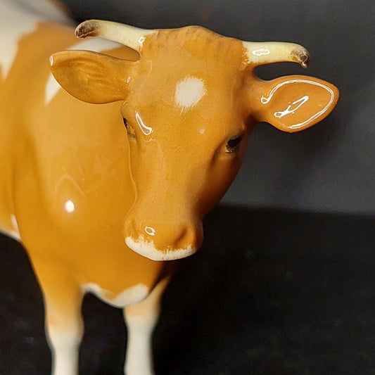 This is a rare No. 1248A 1952-1953 BESWICK Guernsey Cow figurine (horns separate from the ears) first version figurine.&nbsp;

This is a collector's find first version of the Beswick Guernsey Cow with a glossy finish.

As seen in photos, this 1248A 1952-1953 Beswick Guernsey Cow figurine has the Beswick England back stamp.

This Guernsey Cow has had a single owner and was carefully stored.&nbsp;

Excellent as new condition.&nbsp; No chips, no cracks, no crazing, no repairs.