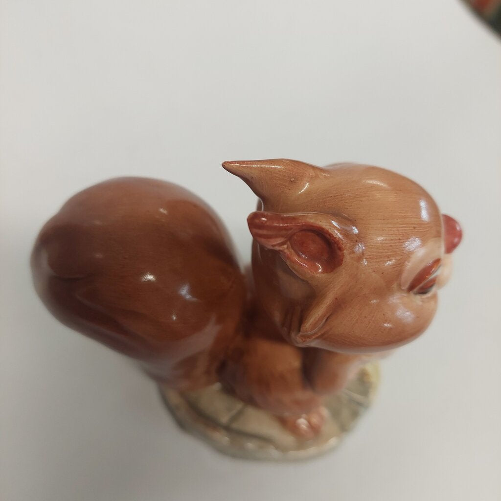 This is a David Hand's Ginger Nutt figurine 1152 of Animaland Series by Beswick England. 1949-1955

The Ginger Nutt figurine is one of eight characters in David Hand's Animaland character series. Ginger Nutt is a red squirrel.

The figurine is 3-1/2 inches (9cm) tall.