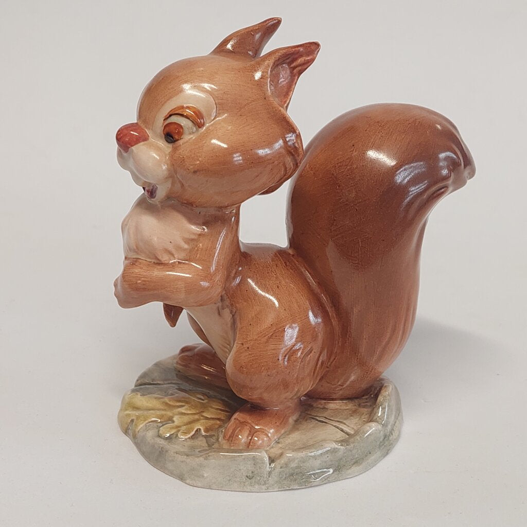 This is a David Hand's Ginger Nutt figurine 1152 of Animaland Series by Beswick England. 1949-1955

The Ginger Nutt figurine is one of eight characters in David Hand's Animaland character series. Ginger Nutt is a red squirrel.

The figurine is 3-1/2 inches (9cm) tall.

The backstamp is gold and reads: David Hand's Animaland, "Ginger Nutt" Beswick England (circle) 6, Copyright by GB Animations Ltd.