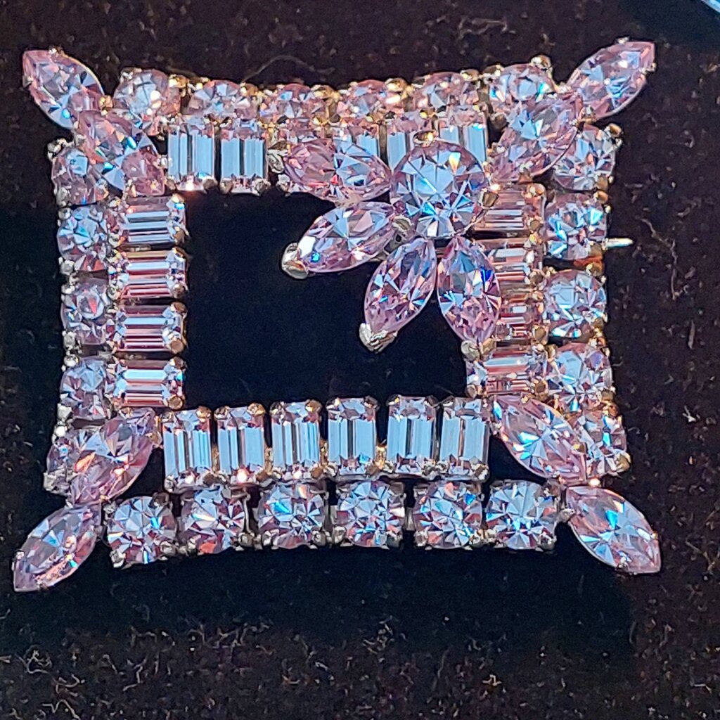This is a rare vintage 1950s Sherman necklace, clip on earrings, and brooch set in an amazing mauve colour. The crystals are a unique mix of baguette, marquise, round, and teardrop cuts. The 4 piece set comes in their original hinged box.