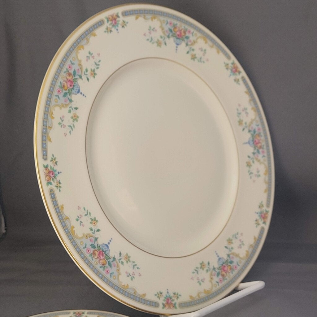 Decorative ceramic plate with floral patterns on a gray background