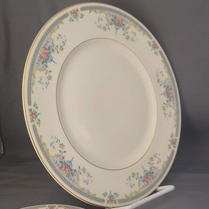 Decorative ceramic plate with floral patterns on a gray background