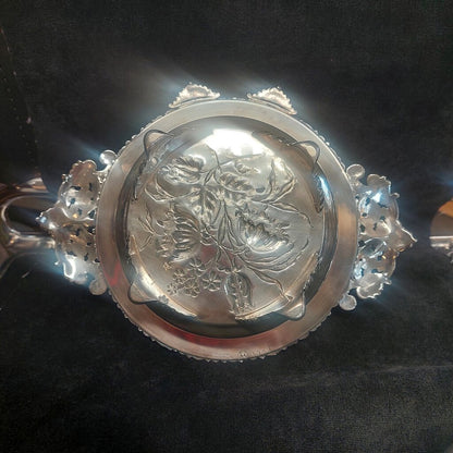 Silver bracelet with intricate design on a dark background