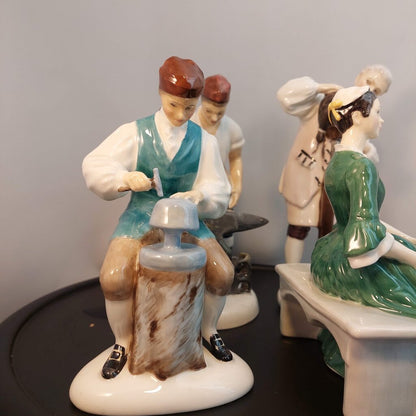 Lot of 4 Royal Doulton Williamsburg Figurines Blacksmith, Wigmaker, Lady, Silversmith