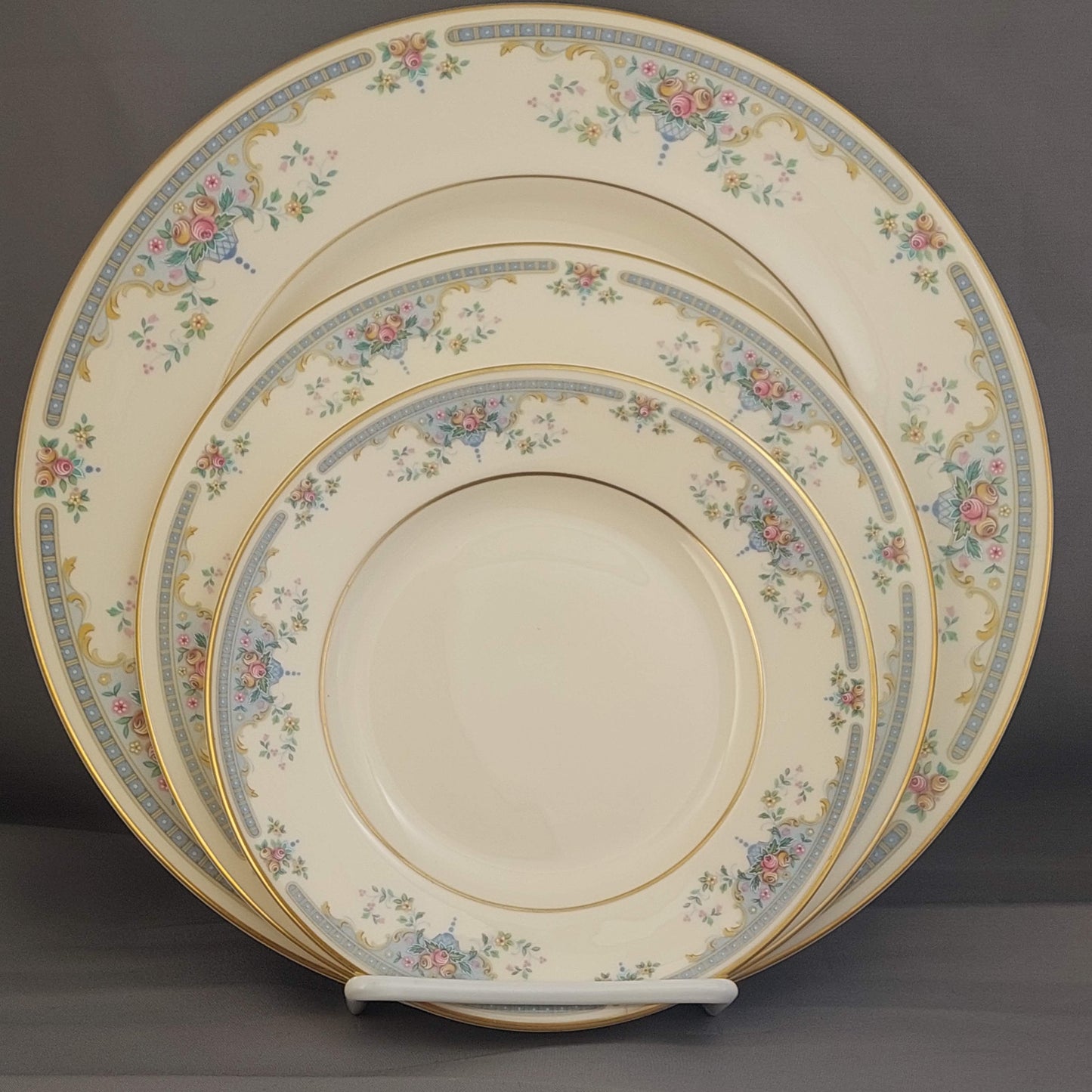 Set of decorative plates with floral patterns on a dark background