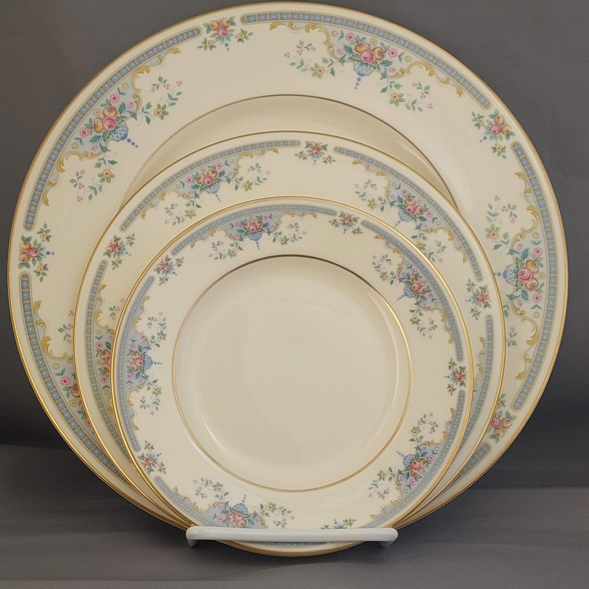 Set of decorative plates with floral patterns on a dark background