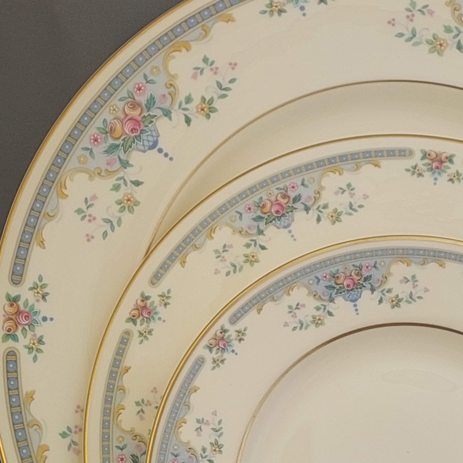 Set of decorative plates with floral patterns on a neutral background